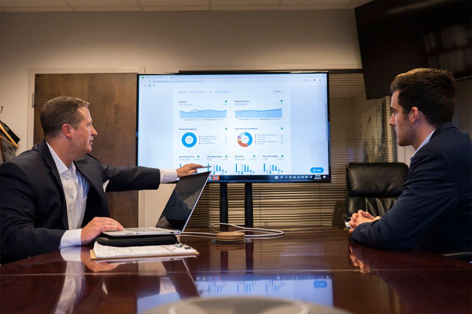 Jason talking about statistics with a client