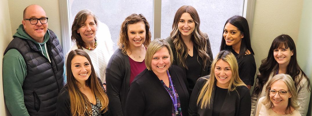 The entire Kids FIRST staff standing together in support of providing abused children with a safe space, intervention, and advocacy.