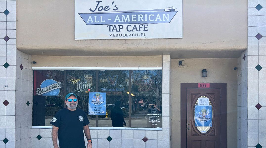 Joe St. John in front of his business, Joe’s All American Tap Cafe in Vero Beach, Florida.